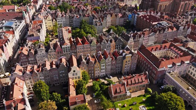 Side flying drone, Gdansk Poland old town showcasing colorful historic houses