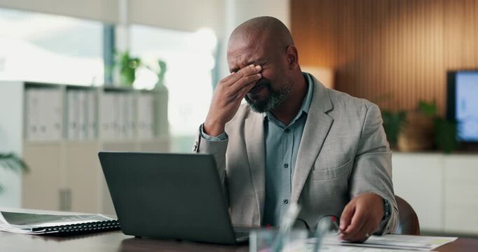 Laptop, glasses and business man with headache for tax season stress, audit deadline or burnout. Accountant, mature black person or eyewear migraine at firm for filing workload, eye strain or tension