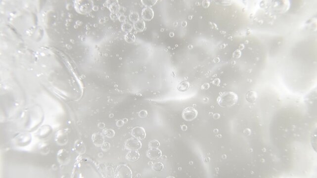 Cosmetics serum gel background, transparent cream texture, facial mask treatment
