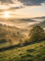 Obraz premium Golden Sunrise Over Misty Countryside Hills with Rolling Green Landscape and Soft Morning Light, Peaceful Nature Panorama