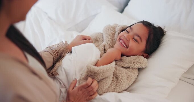 Laughing, mother and tickle child in bed for morning fun, bonding together or healthy relationship. Funny, mom and daughter with playing in bedroom for connection, happy family or development in home