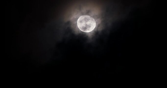 Cinematic Moon Behind Heavy Night Clouds, Moody Moonlight Graphic Element for Video Design