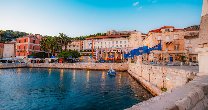 The grand St. Stephen's Square in Hvar town,  the Cathedral, the historic Arsenal, and elegant Venetian-style stone architecture, Croatia.