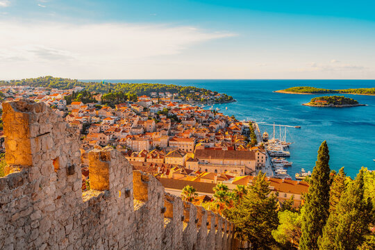 Hvar town and Pakleni Islands viewed from the medieval Spanish Fortress, golden hour over the Adriatic sea, Croatia.