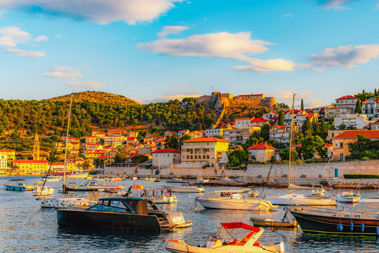Hvar town and Pakleni Islands viewed from the medieval Spanish Fortress, golden hour over the Adriatic sea, Croatia.