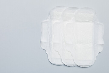 Women hygiene products or sanitary pad on colored background. Pastel color. Closeup. Empty place for text. Female daily hygiene © sosiukin