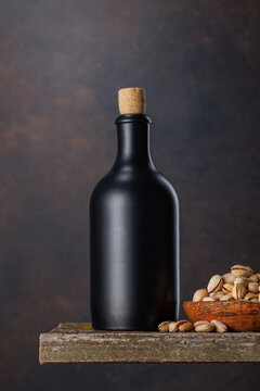 Beer bottle with pistachios