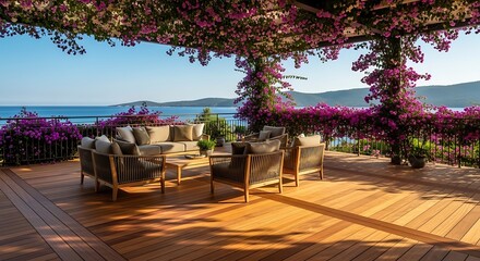 Fototapeta premium Luxurious outdoor patio with comfortable seating under a bougainvillea-covered pergola, overlooking a serene blue sea and distant coastline.