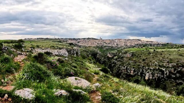 Panorama seen from the Murgia Materana Park, in the distance the city of Matera appears with its famous historic center called "I Sassi di Matera". The video was shot in Basilicata, Southern Italy