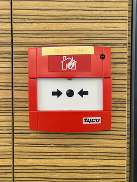 Johor, Malaysia, May 13, 2026: Fire Alarm Call Point on Wooden Wall