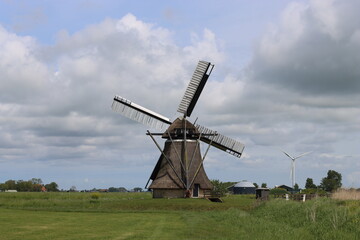 Fototapeta premium Traditional old wooden windmill in The Netherlands