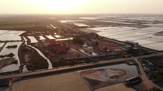 Aerial view of salt harvesting ponds over coastal Thailand, crystal salt ponds.