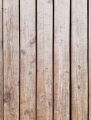 Fototapeta premium High angle view of vintage weathered wooden planks. Natural vertical barn wood boards texture background with knots and scratches. Empty rustic surface for construction, eco or retro design 