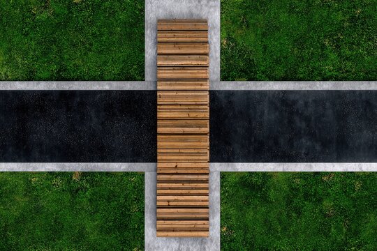 Top-down view of a modern outdoor public space with grass, path, and wood bench