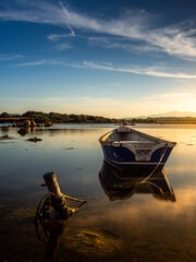 Fototapeta premium Fishermen''s boats in a bay in the sunset