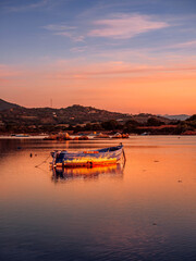 Fototapeta premium Fishermen''s boats in a bay in the sunset