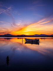 Fototapeta premium Fishermen''s boats in a bay in the sunset