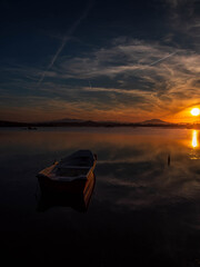 Fototapeta premium Fishermen''s boats in a bay in the sunset