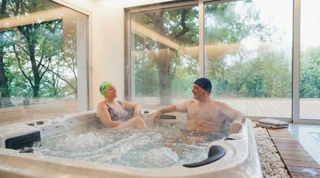 Couple relaxing in a hot tub with a view of nature