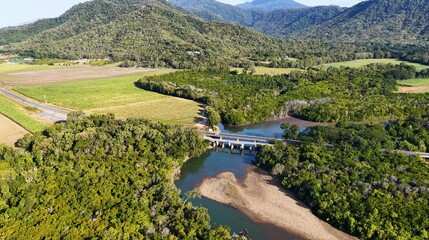 Fototapeta premium Aerial View of a Bridge Over a Tropical River in Queensland Australia