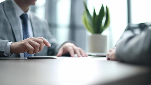 Two professionals engage in a focused business discussion