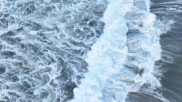 Close aerial texture of turbulent ocean foam