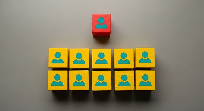 Red Person Cube Atop Group of Yellow Blocks Depicting Organizational Hierarchy Structure