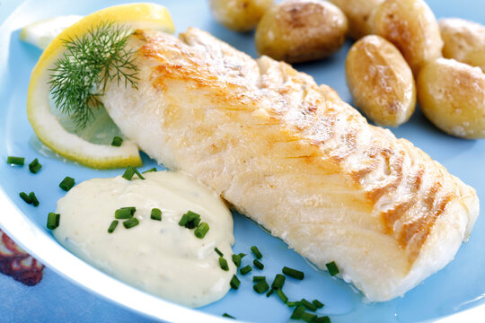 Codfish and remolade with roast potatoes, close-up