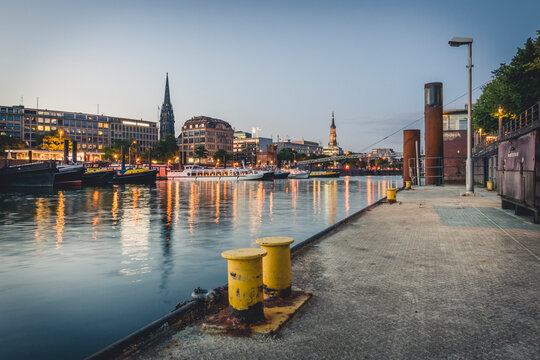 Germany, Hamburg, inland harbour and cityscape at blue hour