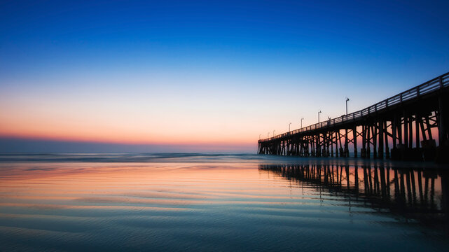 USA, Florida, View Daytona Beach with pier at sunrise
