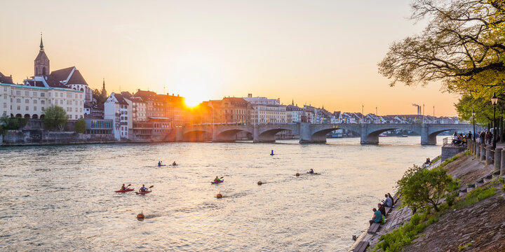 Switzerland, Basel, city view from the bank of the Rhine at dusk