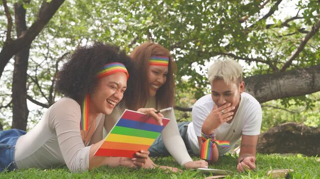 Latina women in love with cross-dressing men and tomboys, happily kissing and wearing Pride flags and celebratory outfits for parades in parks, all part of the Pride and LGBTQ festival concept