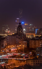 Fototapeta premium Beijing skyline at night, cityscape of skyscrapers, traffic lights and light trails
