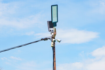 Obraz premium Modern LED Street Lamp and Security Camera on a Pole