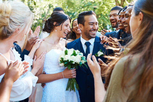 Couple, people and applause with smile at wedding for love, celebration or commitment ceremony. Happy, bride and groom with guest cheering, congratulations and marriage tradition for special occasion