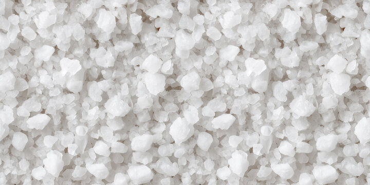 Coarse-grained white salt, seamless texture. Macro, top view, uniform lighting.