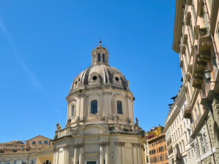 Obraz premium Dome of Santissimo Nome di Maria al Foro Traiano Church in Rome Italy Baroque Architecture of Catholic Basilica Cupola Against Blue Sky Vertical View