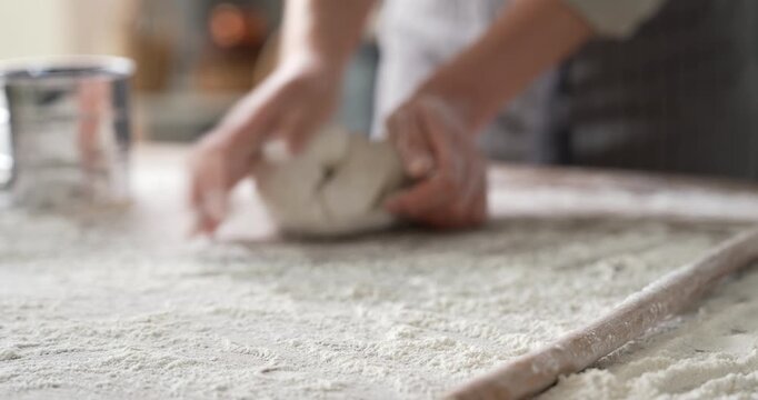 Kneading dough at the kitchen table