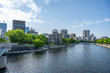 Atomic Bomb Dome Against Blue Sky with Green Trees and Copy Space © 亀山 篠介