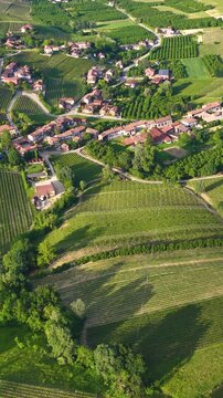 Aerial View of Rolling Vineyards and Village in Piedmont Italy