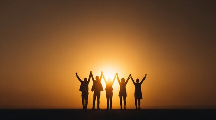 Fototapeta premium Unity at Dawn: A silhouette of five individuals standing together with raised hands, symbolizing togetherness and hope as they face the rising sun.