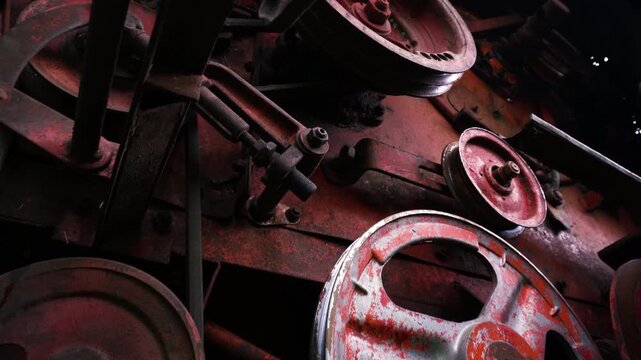 old red combine harvester pulleys for moving belts for threshing wheat barley and soybeans in summer and fall