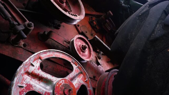 old red combine harvester pulleys for moving belts for threshing wheat barley and soybeans in summer and fall