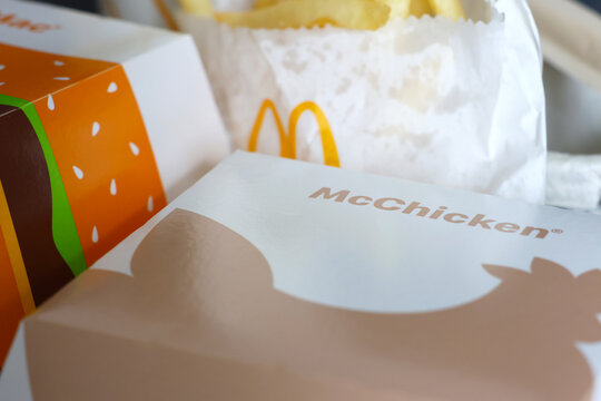 Wroclaw, Poland, April 12, 2026: McDonald's Fast Food Packaging Featuring McChicken Box and French Fries for Takeaway Meals