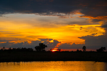 Fototapeta premium twilight Beauty Evening colorful clouds - sunlight with dramatic sky.Dramatic sky reflection in water.