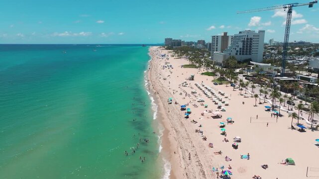 Drone shot over the turquoise water of Las Olas Beach in Fort Lauderdale, Florida.