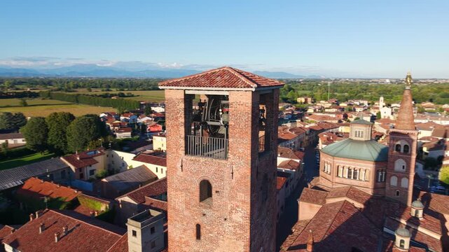 Historic European architecture and travel destinations. An aerial view showcases the prominent clock tower of Soncino, Italy.