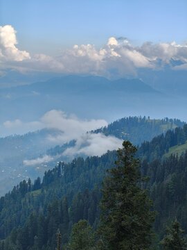 landscape of Ganga Choti mountain under a cloudy blue sky, Azad Kashmir