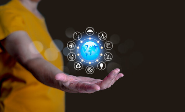 Hand holding glowing digital globe with technology icons, representing global communication,  smart technology, cloud computing, and worldwide business connectivity in a futuristic world.