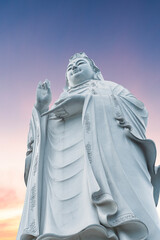 Fototapeta premium Lady Buddha statue on the sunrise. Danang Vietnam.